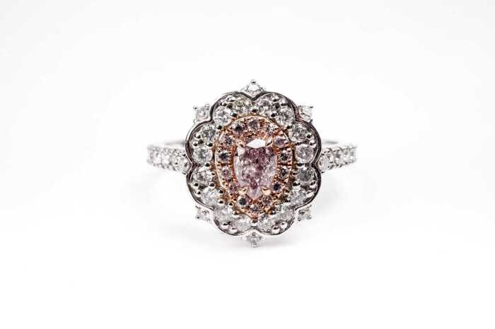A pink and white diamond ring in 14ct white and rose gold