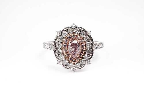 A pink and white diamond ring in 14ct white and rose gold