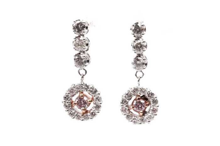 A pair of pink and white diamond earrings in 18 carat white and rose gold