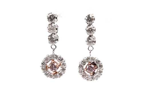 A pair of pink and white diamond earrings in 18 carat white and rose gold
