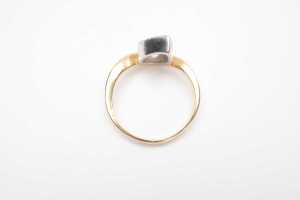 A bezel set pear cut diamond solitaire ring in 18ct yellow and white gold - 4