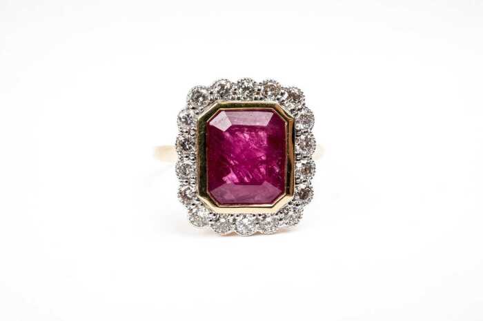 A ruby and diamond ring in 18 carat yellow gold