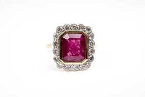 A ruby and diamond ring in 18 carat yellow gold