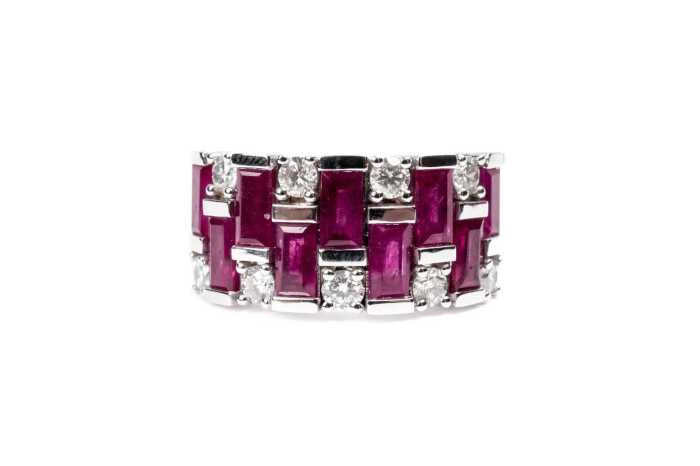 A ruby and diamond ring in 14 carat white gold