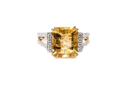 A heliodor and diamond ring in 14 carat yellow gold