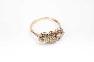 A trilogy halo diamond ring in 14 carat yellow gold - 2