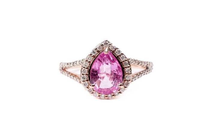 A pink sapphire and diamond ring in 14 carat rose gold