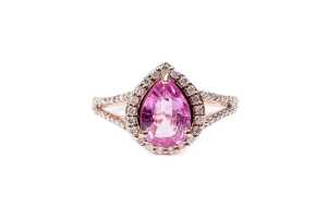 A pink sapphire and diamond ring in 14 carat rose gold