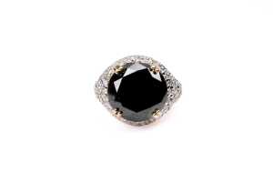 A black and white diamond ring in 14 carat yellow gold