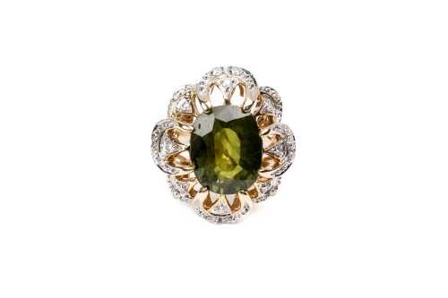 A green sapphire and diamond ring in 14 carat yellow gold