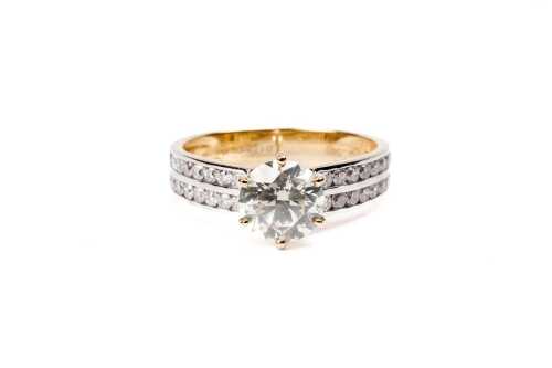 A diamond ring in 14 carat yellow gold