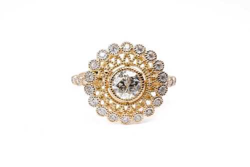 A diamond ring in 14 carat yellow gold