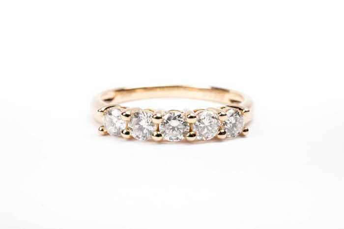 A diamond ring in 14 carat yellow gold