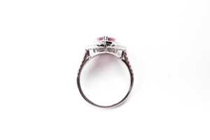 A ruby and diamond halo ring in 14 carat white gold - 3