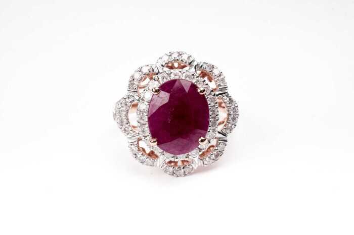 A ruby and diamond ring in 14 carat yellow gold