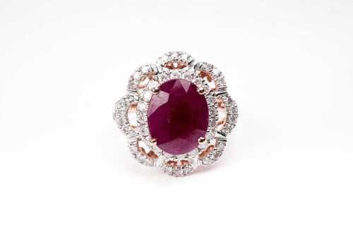 A ruby and diamond ring in 14 carat yellow gold