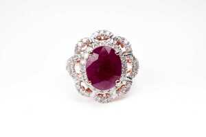 A ruby and diamond ring in 14 carat yellow gold