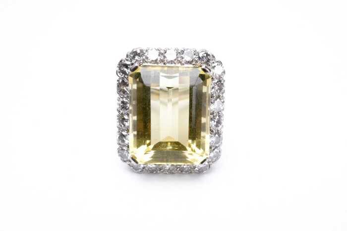 A heliodor and diamond ring in 18 carat white gold