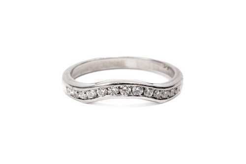 A diamond fitted wedding band in platinum