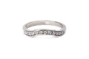 A diamond fitted wedding band in platinum