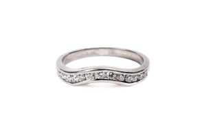 A diamond fitted wedding band in platinum