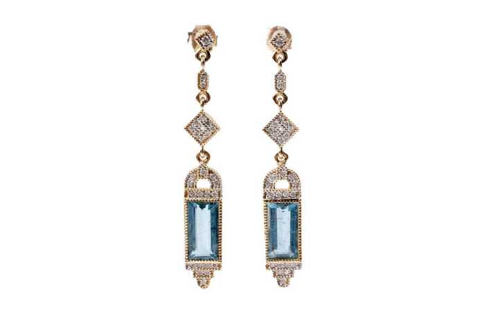 A pair of aquamarine and diamond earrings in 14 carat yellow gold