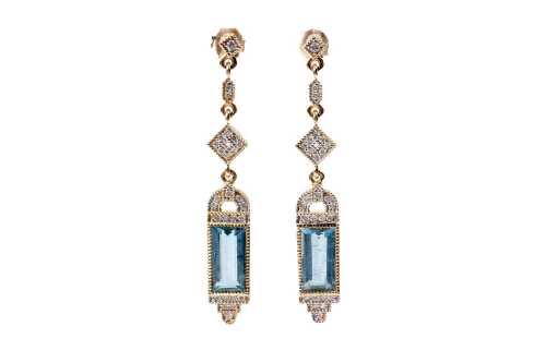 A pair of aquamarine and diamond earrings in 14 carat yellow gold