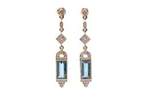 A pair of aquamarine and diamond earrings in 14 carat yellow gold