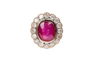 A ruby and diamond ring in 14 carat yellow and white gold