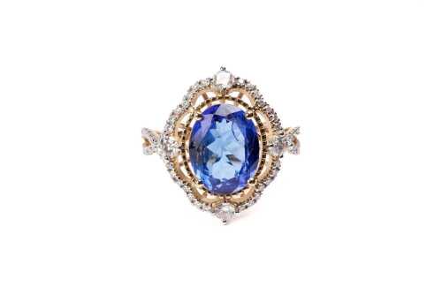 A tanzanite and diamond ring in 14 carat yellow gold