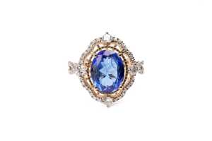 A tanzanite and diamond ring in 14 carat yellow gold
