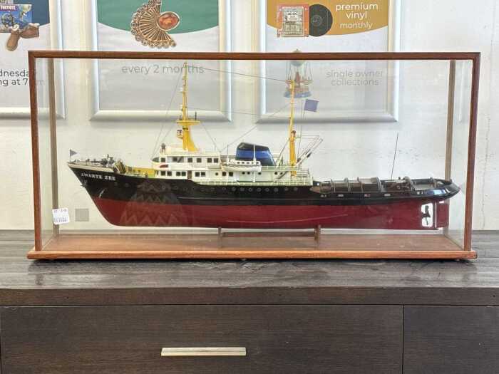Handmade timber model ship of the Zwarte Zee in glass display case.
