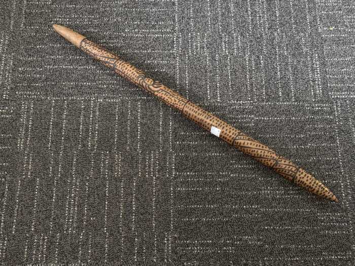 Indigenous digging stick with pokerwork decoration