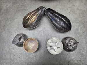Collection of eight metal beetle nut boxes in a hammered and pieced bowl - 2