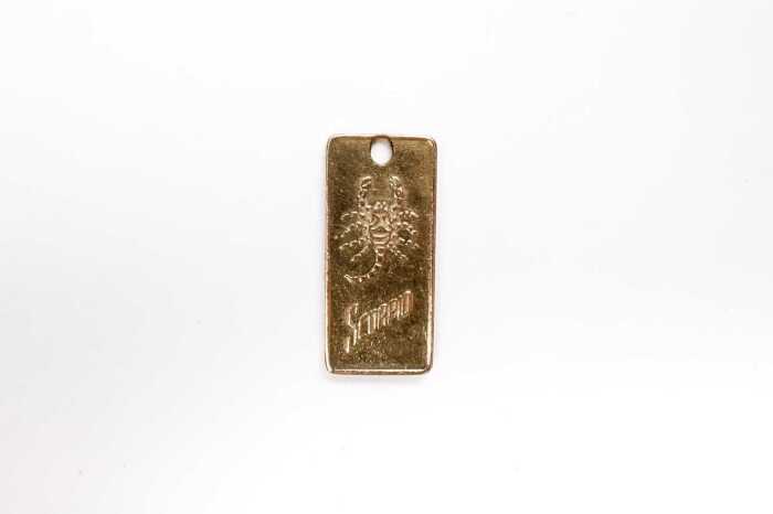 A Scorpio medallion in 9 carat yellow gold