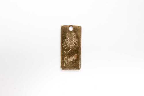 A Scorpio medallion in 9 carat yellow gold