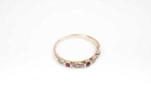 A ruby and diamond ring in 9 carat yellow gold