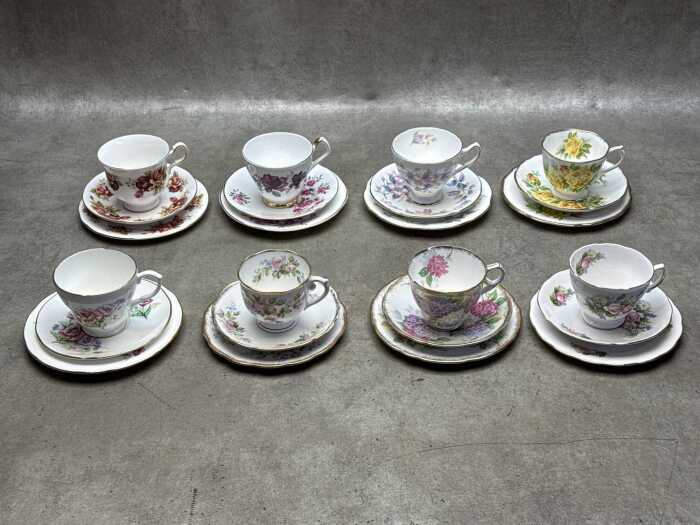 Eight porcelain trios