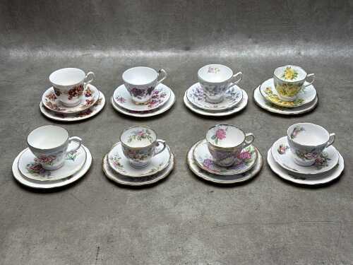 Eight porcelain trios