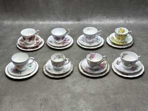 Eight porcelain trios
