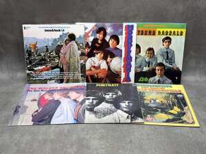 Six '60s Pop vinyl records, including 'Woodstock'