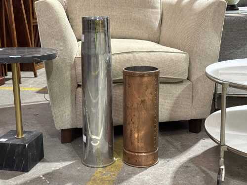 Two vintage metal floor vessels, including an artillery shell case