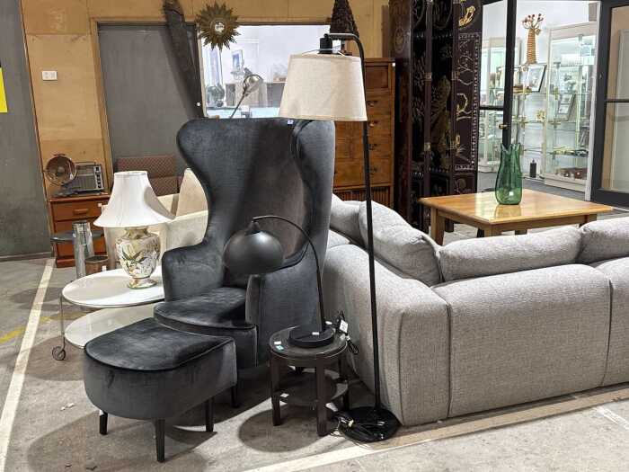 Two brushed metal lamps in matte black, one with cream fabric shade