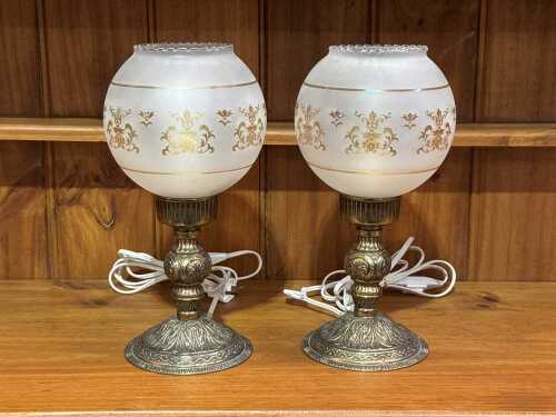 Pair of antique-style table lamps with metal bases and opaque glass shades