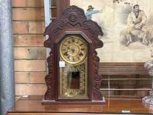 Antique gingerbread-style mantle clock