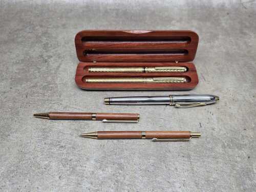 Five ballpoint pens, including Cross