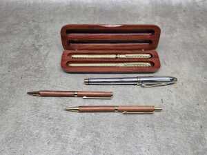 Five ballpoint pens, including Cross