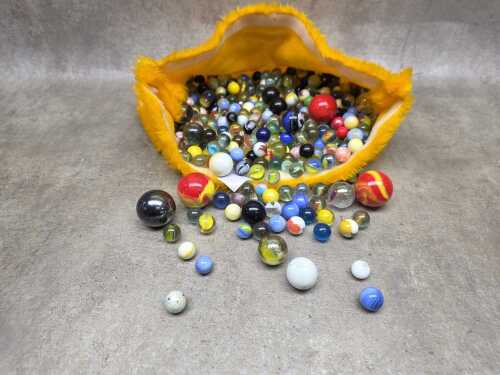 Antique and vintage glass marbles in various sizes.