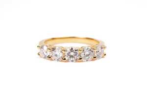 A moissanite ring in gold plated sterling silver
