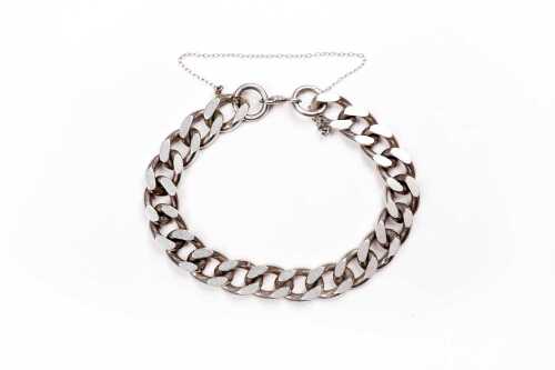 A curb link bracelet in sterling silver